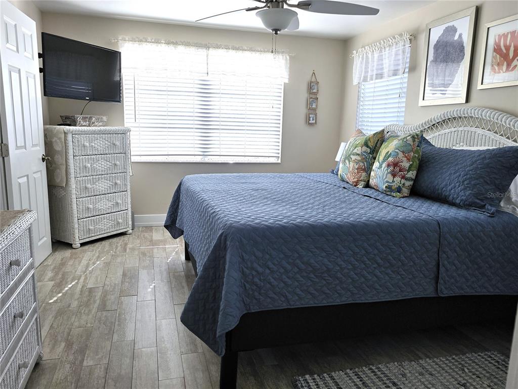 470 South McCall Road, Unit 11 Englewood, FL 34223 - Photo 14 of 22 a bedroom with a bed and a window