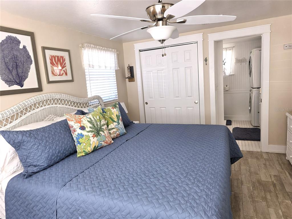 470 South McCall Road, Unit 11 Englewood, FL 34223 - Photo 15 of 22 a bedroom with a bed dresser and a window