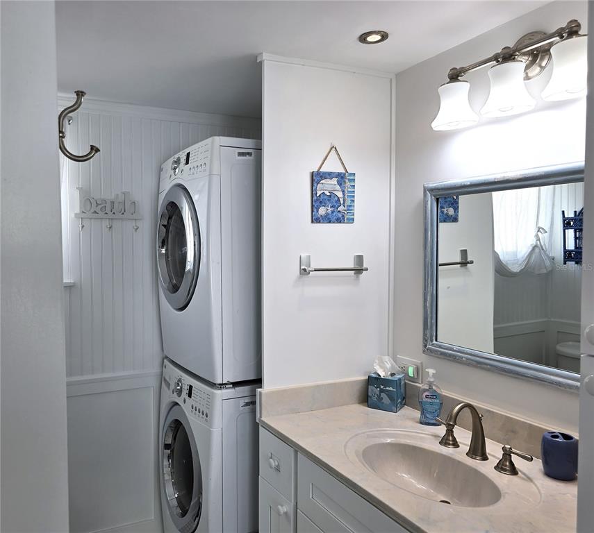 470 South McCall Road, Unit 11 Englewood, FL 34223 - Photo 16 of 22 a bathroom with a sink and a mirror