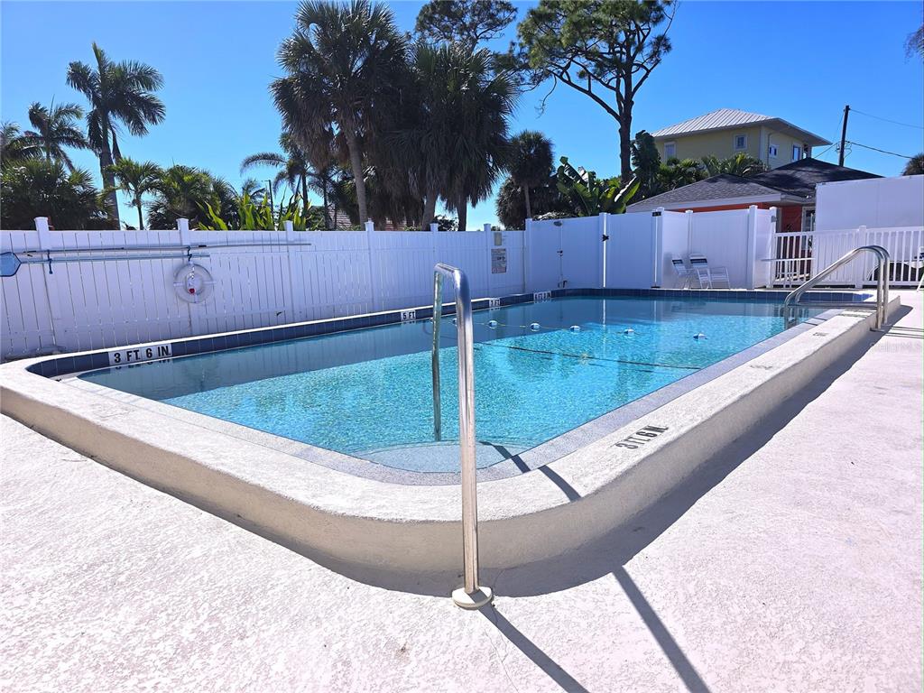 470 South McCall Road, Unit 11 Englewood, FL 34223 - Photo 20 of 22 a view of a backyard