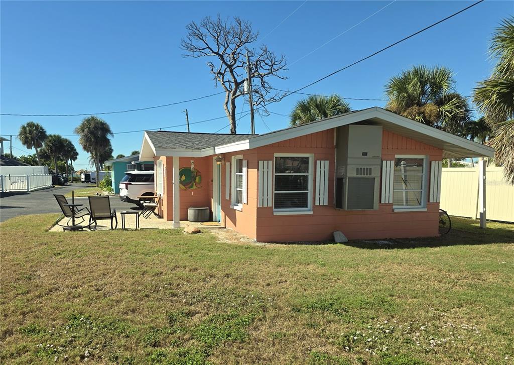 470 South McCall Road, Unit 11 Englewood, FL 34223 - Photo 3 of 22 a front view of a house with garden