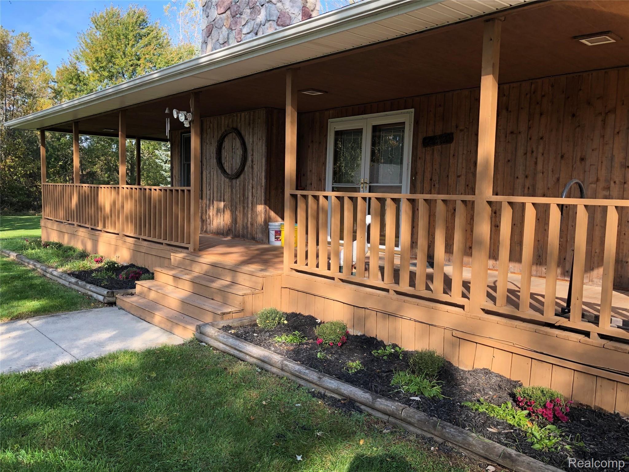 5664 Secord Lake Road Dryden, MI 48428 - Photo 46 of 48 WRAP AROUND COVERED PORCH