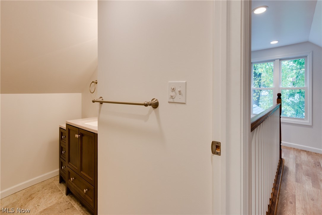 38705 Chardon Road Willoughby Hills, OH 44094 - Photo 16 of 35 View from the bedroom into the bathroom upstairs and the loft area of the upstairs bedroom - with extra big windows on both ends of the room and storage galore in that area