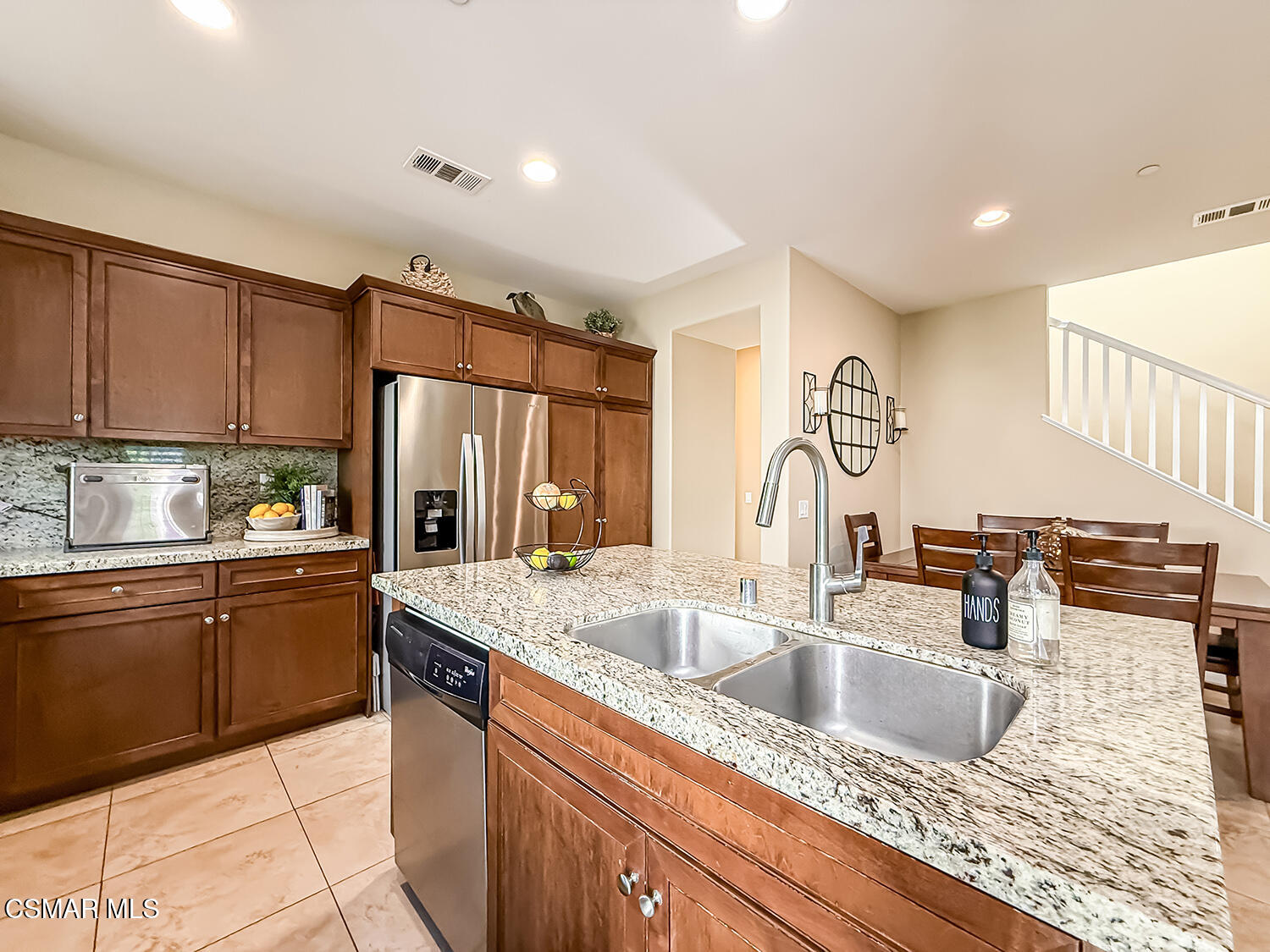 2968 Royal Avenue Simi Valley, CA 93065 - Photo 13 of 45 a kitchen with stainless steel appliances granite countertop a sink refrigerator and cabinets