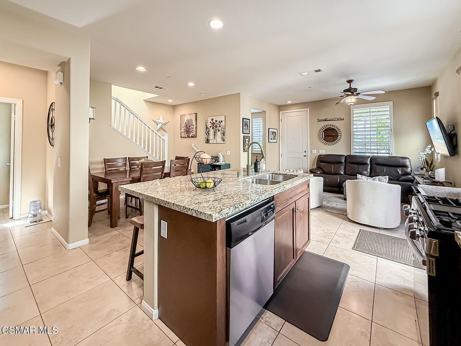 2968 Royal Avenue Simi Valley, CA 93065 - Photo 14 of 45 a kitchen with granite countertop sink table and chairs