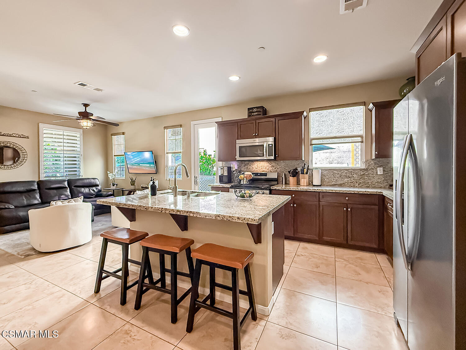 2968 Royal Avenue Simi Valley, CA 93065 - Photo 15 of 45 a kitchen with a sink cabinets and refrigerator