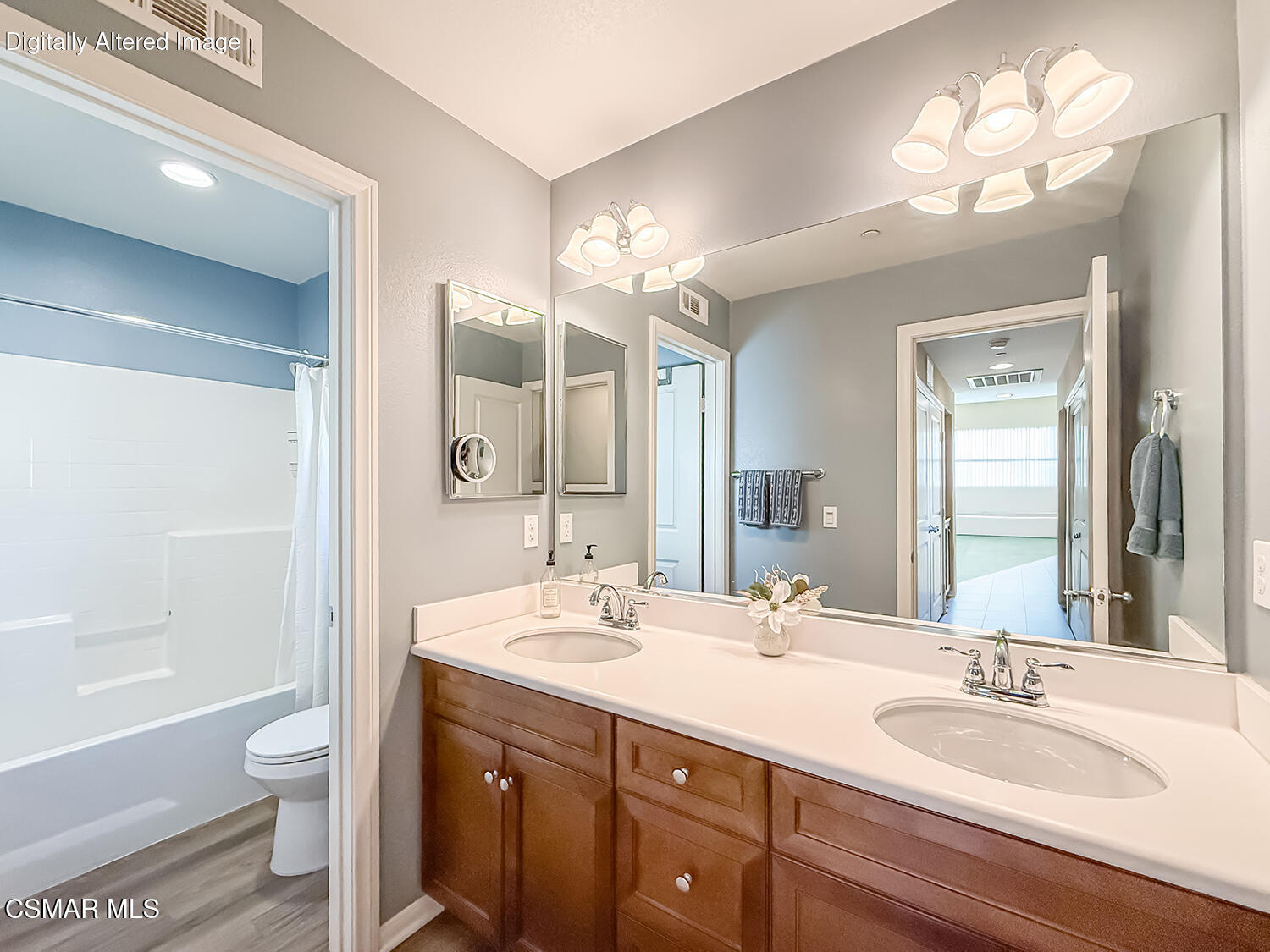 2968 Royal Avenue Simi Valley, CA 93065 - Photo 25 of 45 a bathroom with a granite countertop double vanity sink a toilet and a large mirror