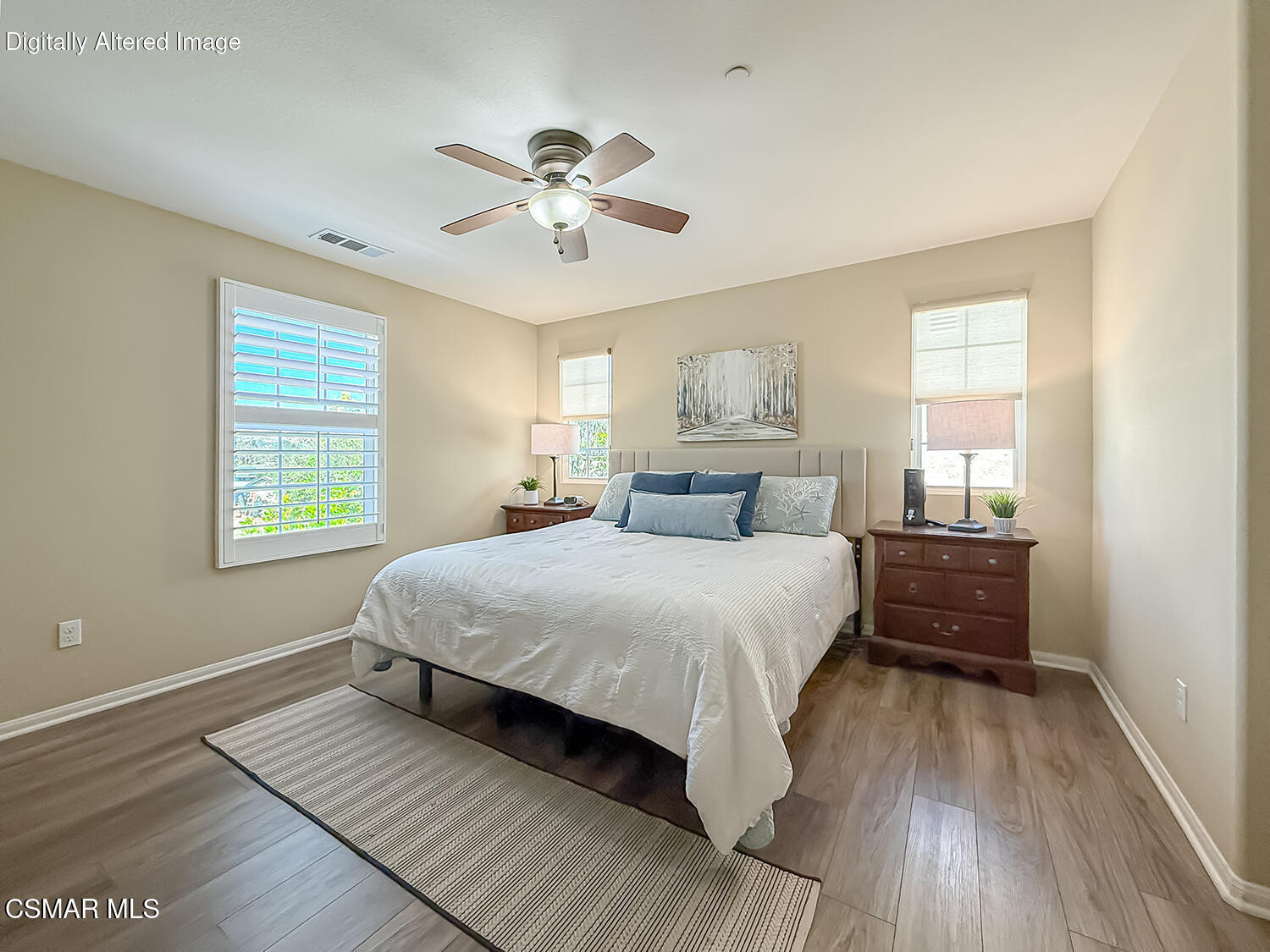 2968 Royal Avenue Simi Valley, CA 93065 - Photo 29 of 45 a bedroom with a bed and wooden floor