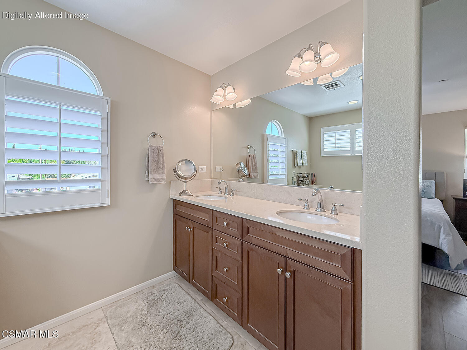2968 Royal Avenue Simi Valley, CA 93065 - Photo 32 of 45 a bathroom with a double vanity sink and a mirror