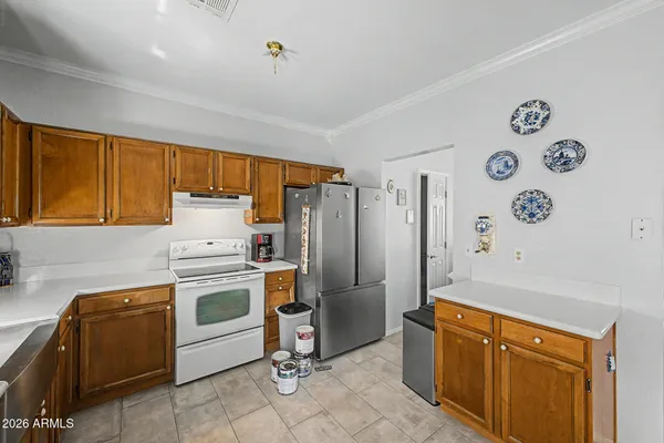 a living room with fireplace furniture and a large window