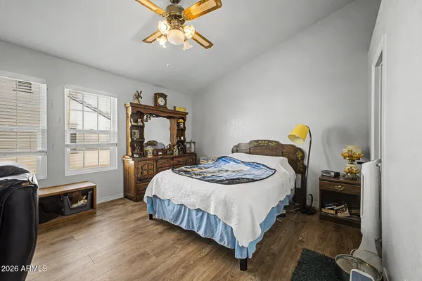a living room with furniture a rug and a flat screen tv