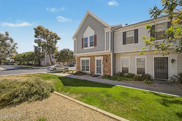 a front view of a house with a yard table and chairs