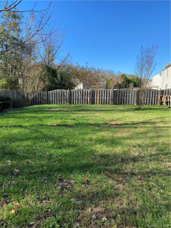 8720 Chalkstone Road Charlotte, NC 28216 - Photo 4 of 6 a view of a grassy field with trees