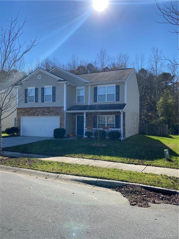 8720 Chalkstone Road Charlotte, NC 28216 - Photo 5 of 6 a front view of a house with a yard