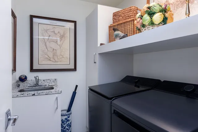 a view of a patio with table and chairs and potted plants