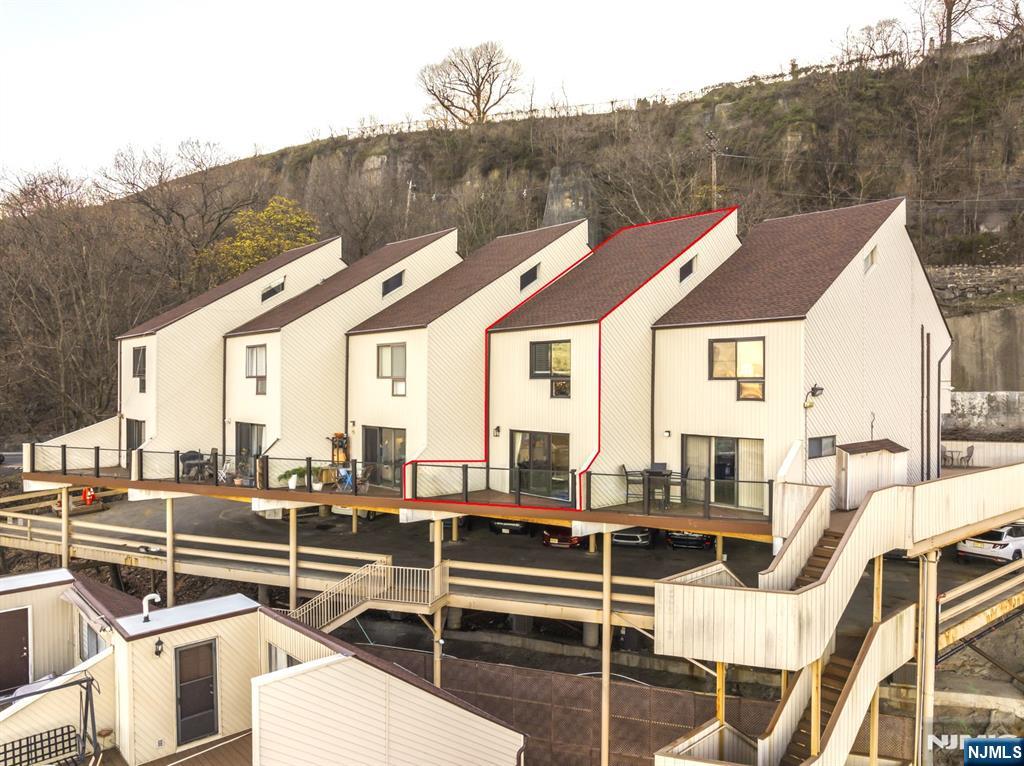 101 Highway 5, Unit 304 Edgewater, NJ 07020 - Photo 12 of 24 a view of a patio with couches table and chairs