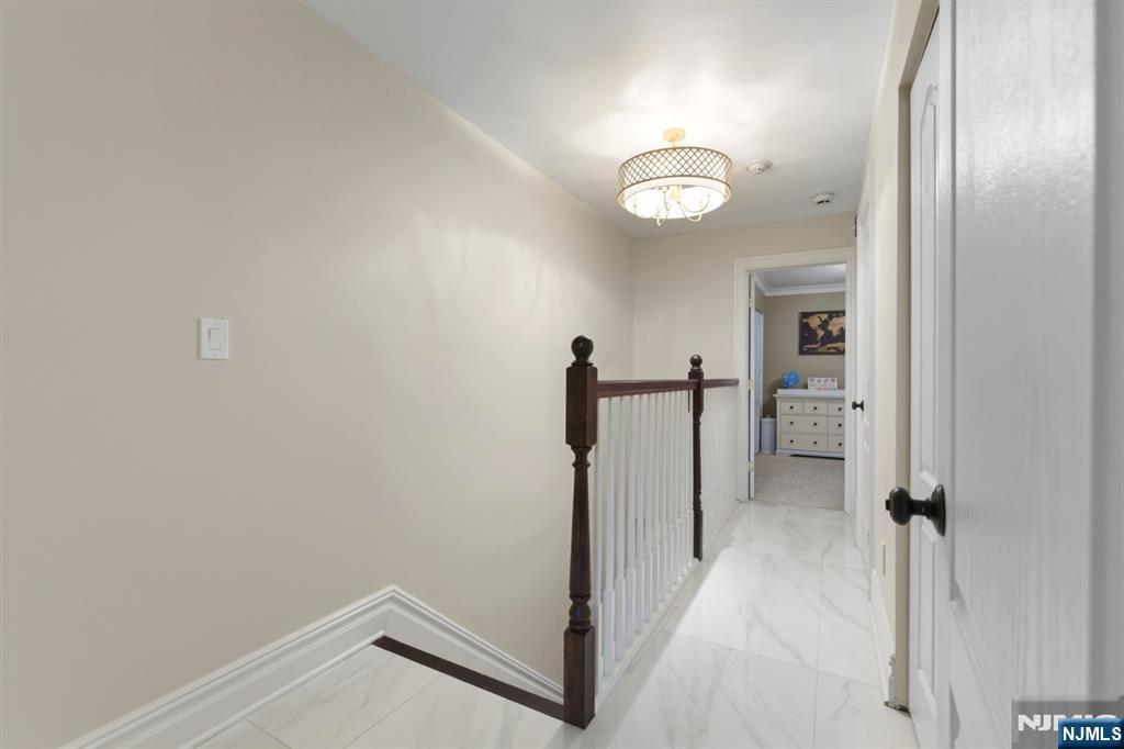 101 Highway 5, Unit 304 Edgewater, NJ 07020 - Photo 14 of 24 a view of a room with wooden floor