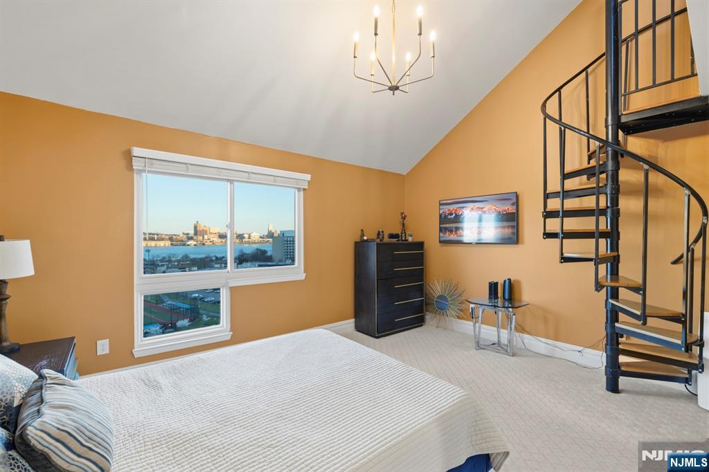 101 Highway 5, Unit 304 Edgewater, NJ 07020 - Photo 18 of 24 a bedroom with furniture and a window