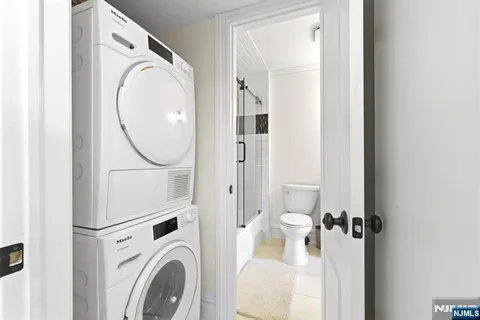 a view of a hallway with washer and dryer