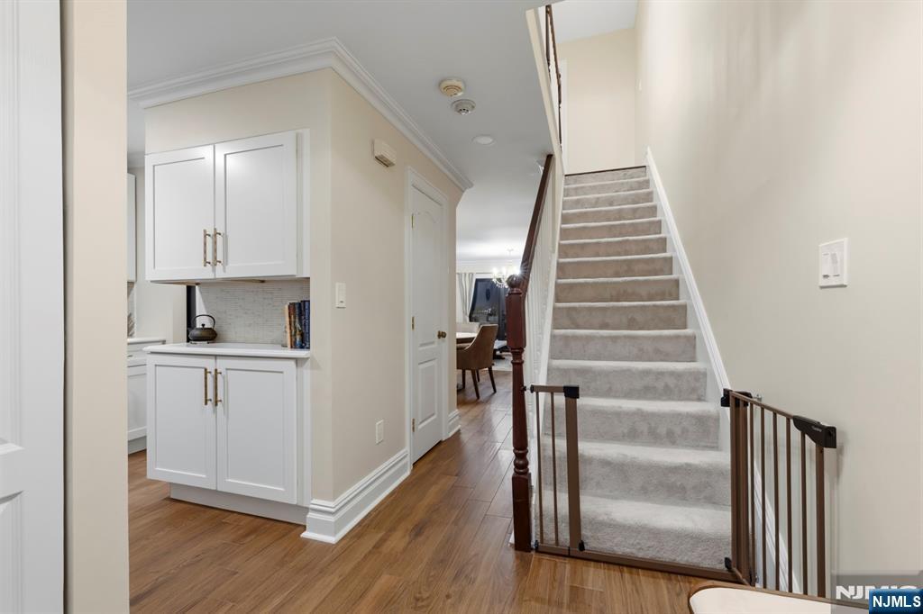 101 Highway 5, Unit 304 Edgewater, NJ 07020 - Photo 3 of 24 a view of entryway and hall with wooden floor