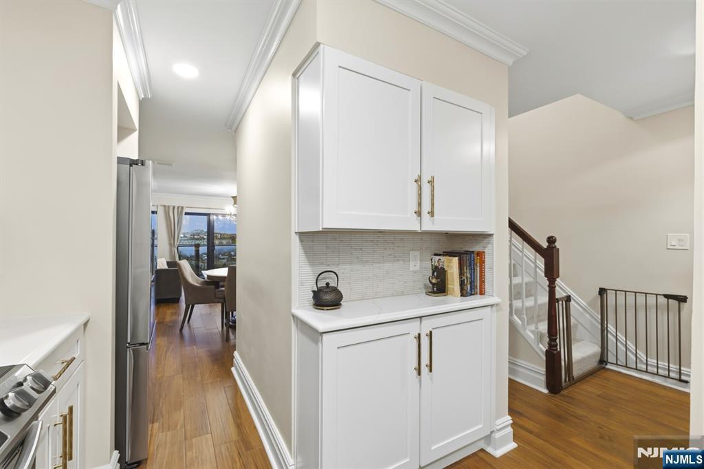 101 Highway 5, Unit 304 Edgewater, NJ 07020 - Photo 4 of 24 a view of a kitchen from the hallway
