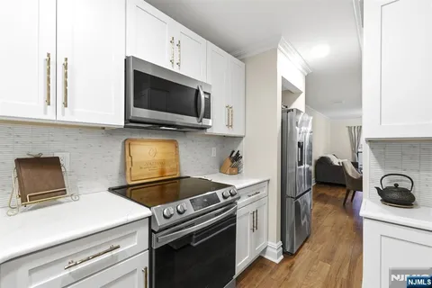 a kitchen with a stove and a microwave