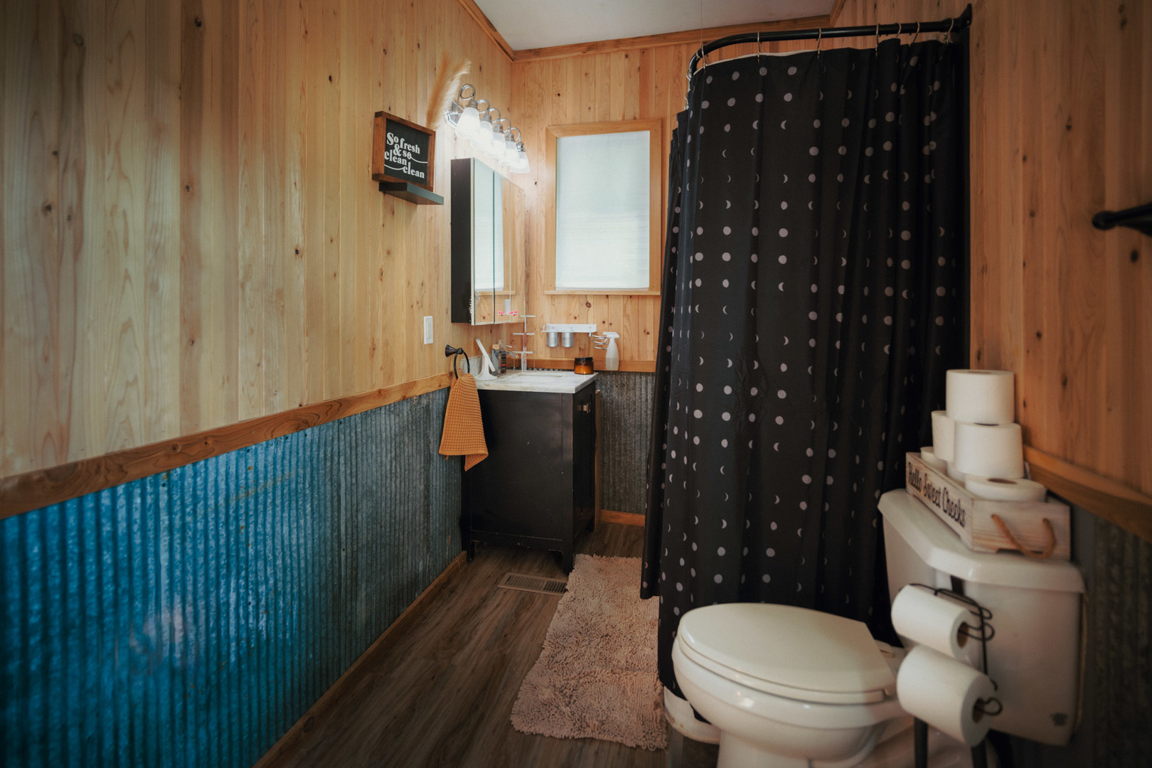 3915 East 758th Road Triumph, IL 61371 - Photo 9 of 15 a bathroom with a toilet a sink and a shower curtain