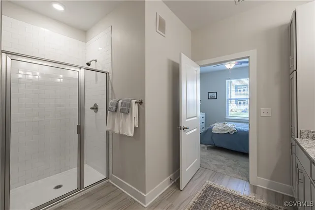 a bathroom with a shower and a sink