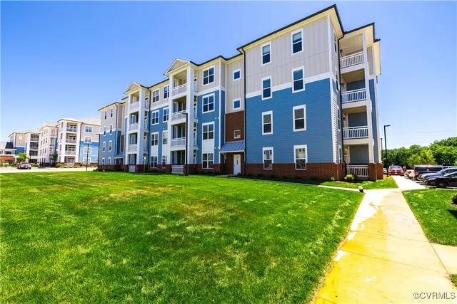 a view of a building with a yard