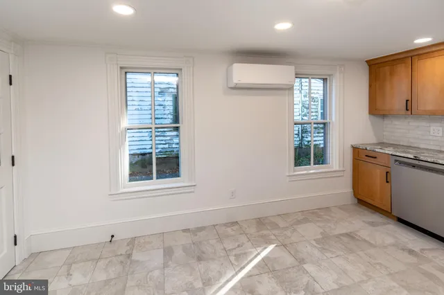 a view of a kitchen with a sink dishwasher and a microwave