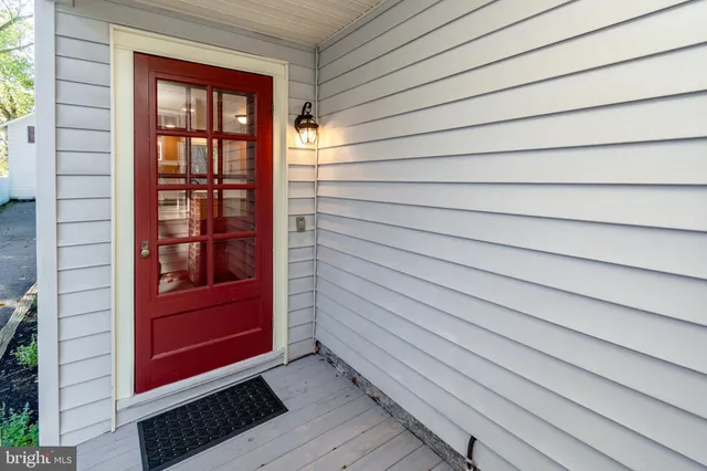 a view of front door and bedroom