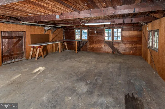 a view of an empty room with wooden roof