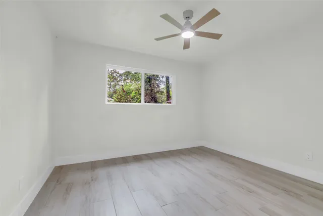 a bathroom with a white bath tub and a shower