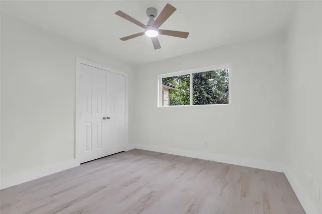 a bathroom with a sink a toilet and vanity