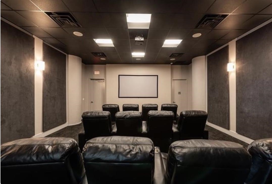 50 Dey Street, Unit 259 Jersey City, NJ 07306 - Photo 20 of 24 a media room with lots of chairs and a projector