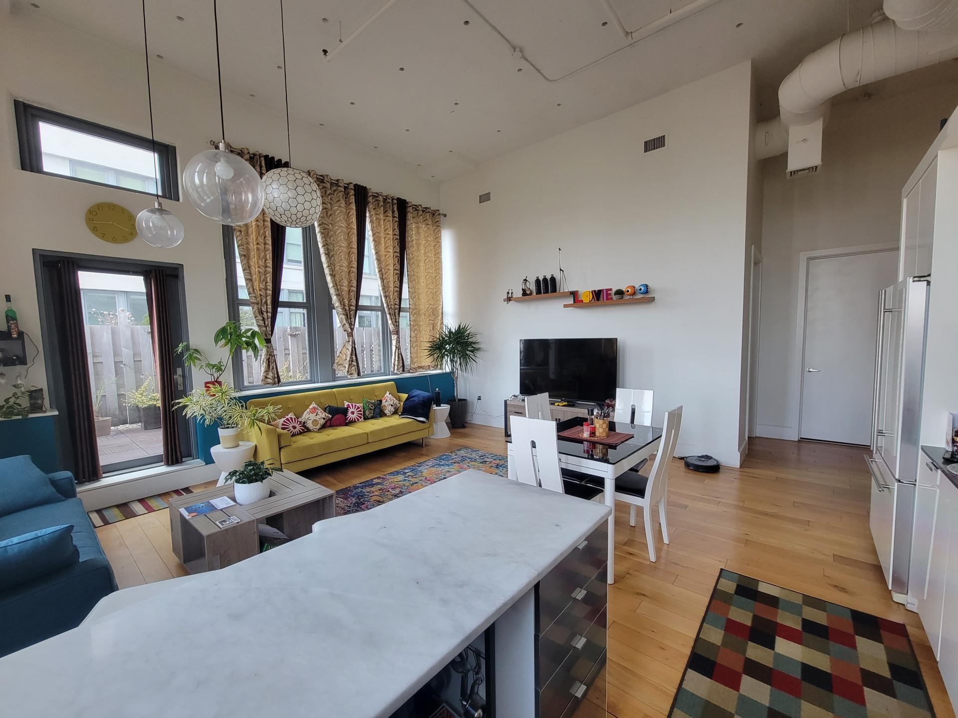 50 Dey Street, Unit 259 Jersey City, NJ 07306 - Photo 3 of 24 a living room with furniture fireplace and flat screen tv
