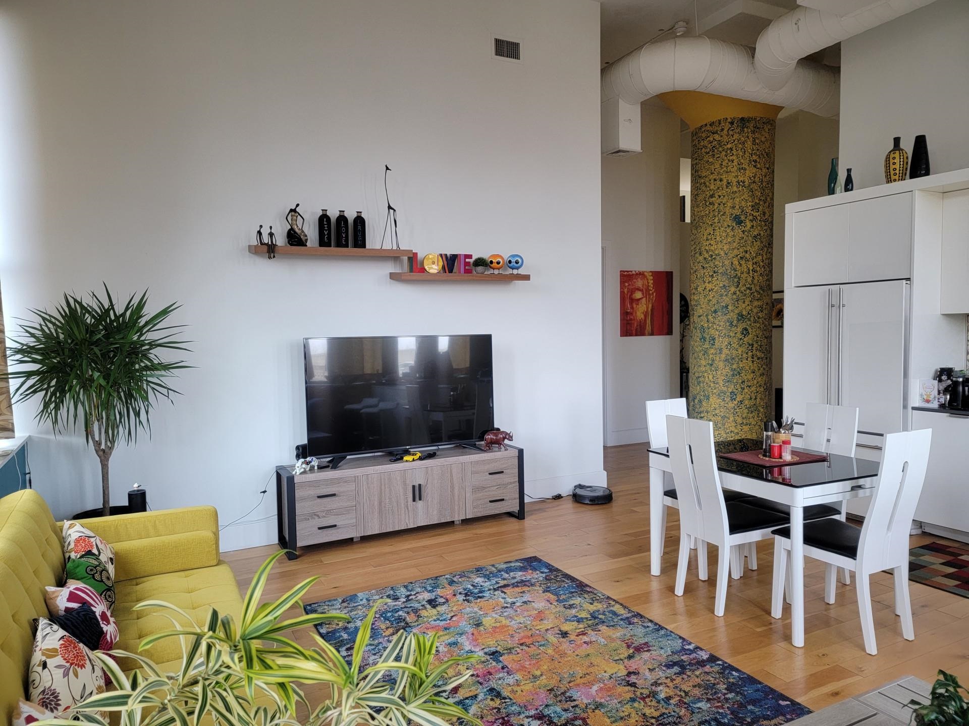 50 Dey Street, Unit 259 Jersey City, NJ 07306 - Photo 4 of 24 a living room with furniture and a flat screen tv