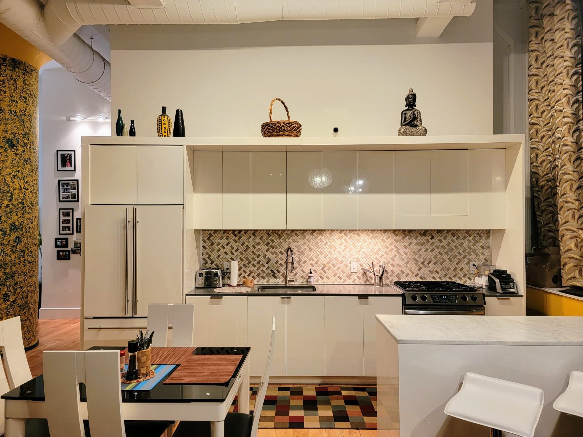 50 Dey Street, Unit 259 Jersey City, NJ 07306 - Photo 5 of 24 a view of a kitchen with stainless steel appliances granite countertop a sink and a stove