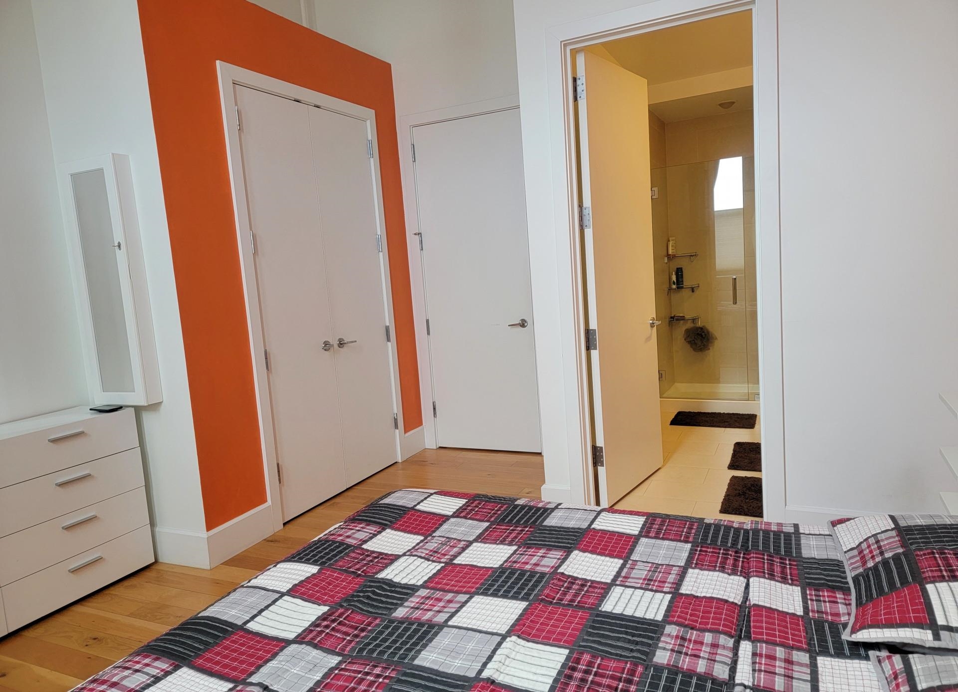 50 Dey Street, Unit 259 Jersey City, NJ 07306 - Photo 8 of 24 a bedroom with a bed and a mirror