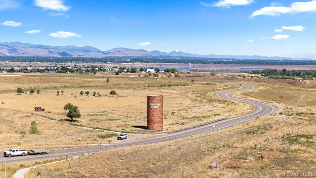 a kitchen with kitchen island white cabinets stainless steel appliances and sink