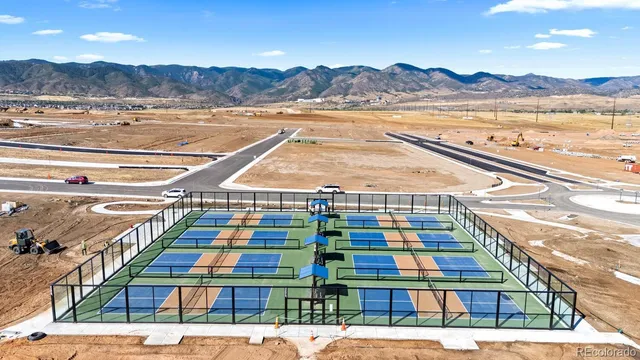 a kitchen with a refrigerator and a stove top oven