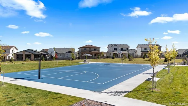 a view of room with wooden floor and fan