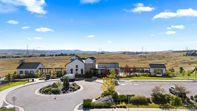 a view of swimming pool with outdoor seating and city view