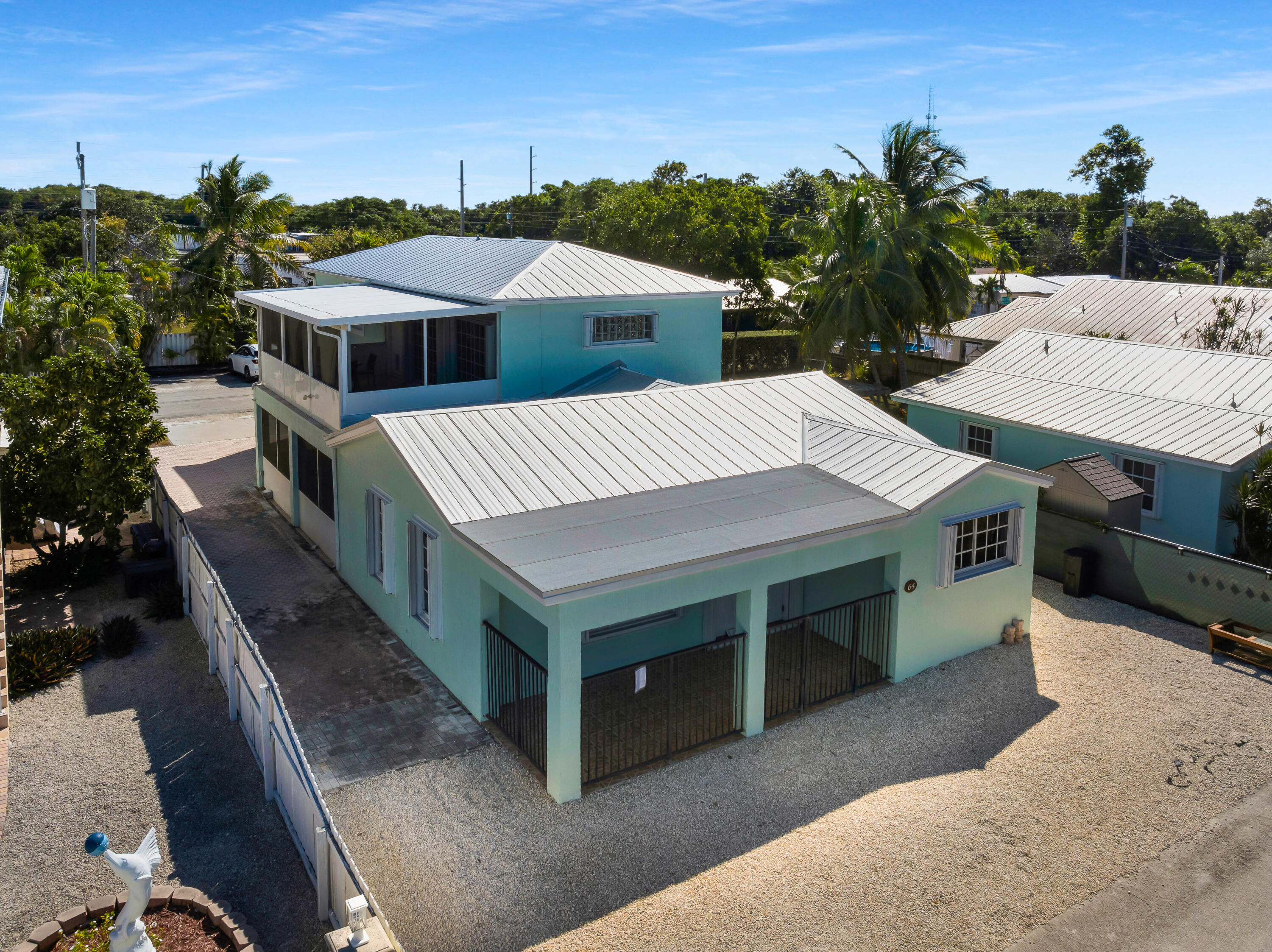 a view of a house with roof deck front of house