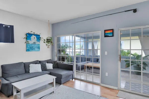 a bedroom with two beds and a couch