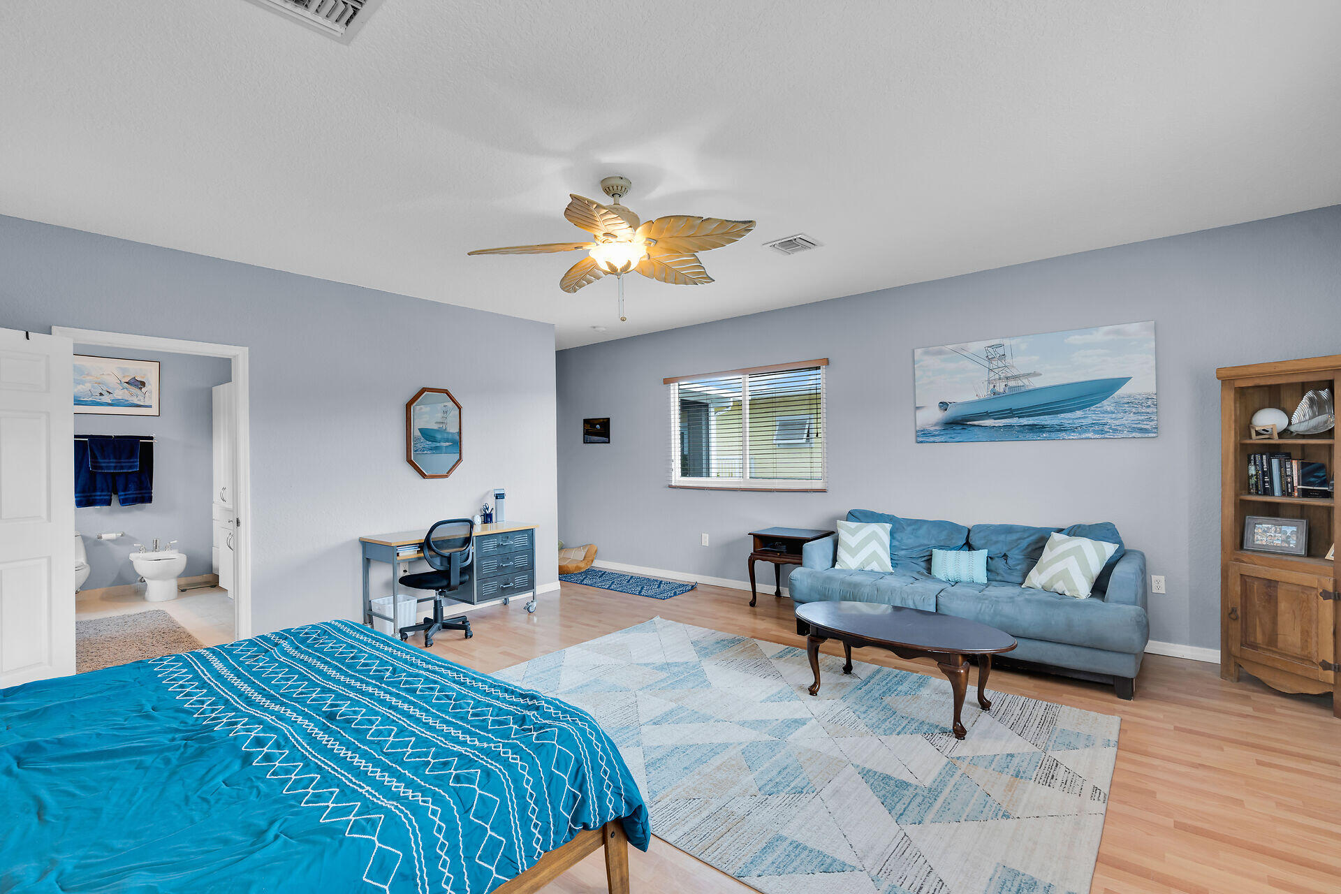 64 Coconut Drive Key Largo, FL 33037 - Photo 15 of 54 a bedroom with a bed and a chandelier