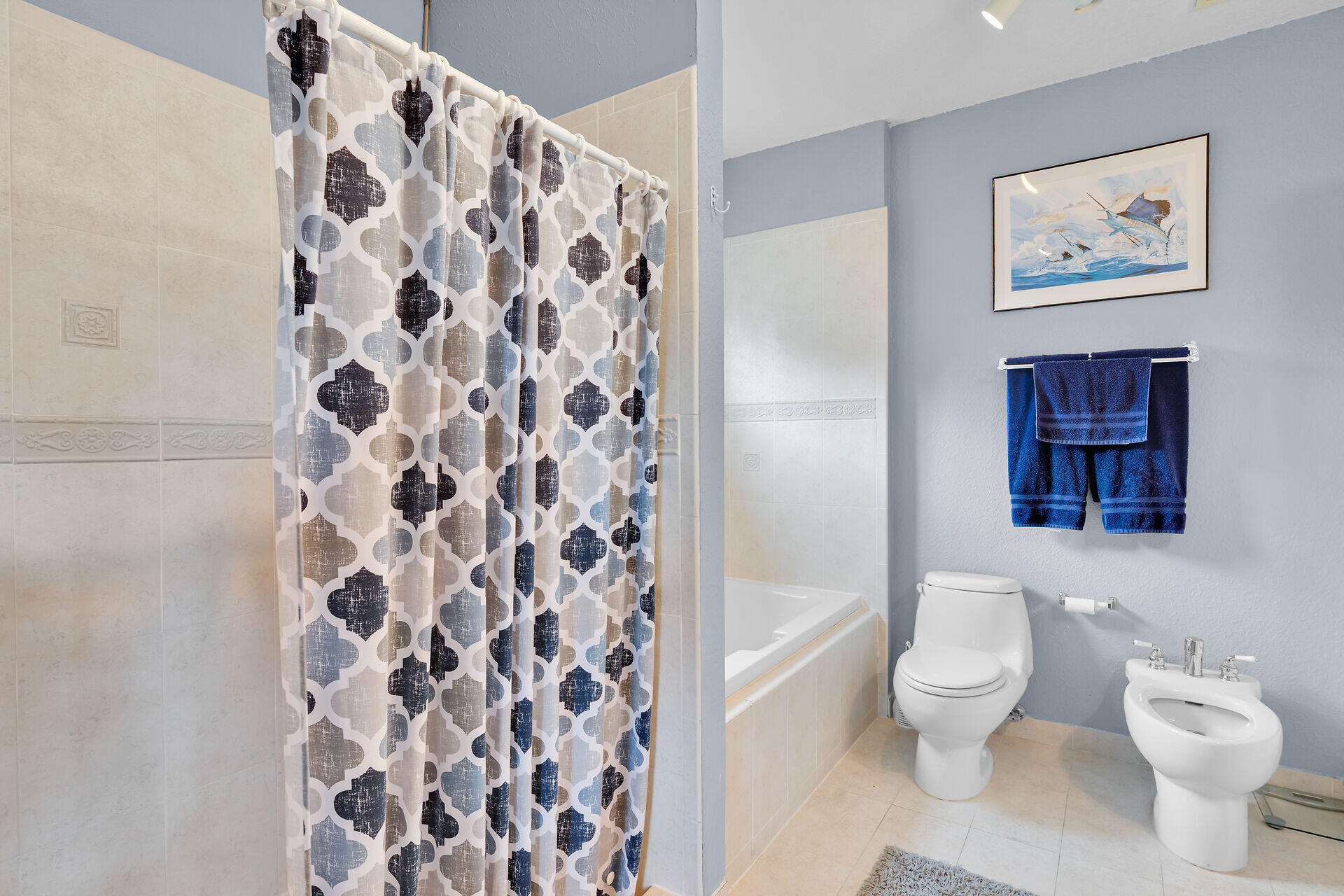 64 Coconut Drive Key Largo, FL 33037 - Photo 21 of 54 a white toilet sitting next to a bathroom sink