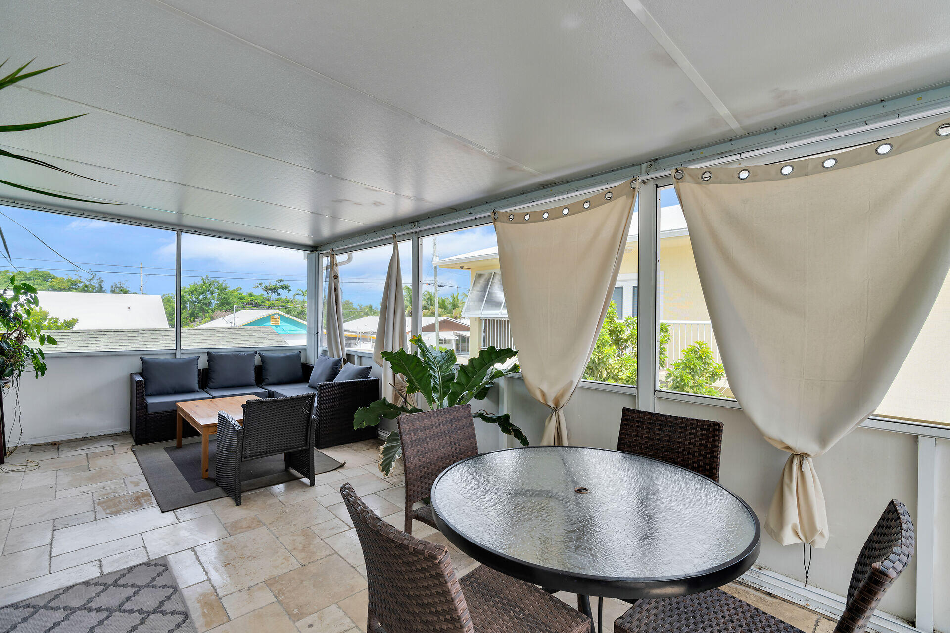 64 Coconut Drive Key Largo, FL 33037 - Photo 24 of 54 a living room with furniture and a large window