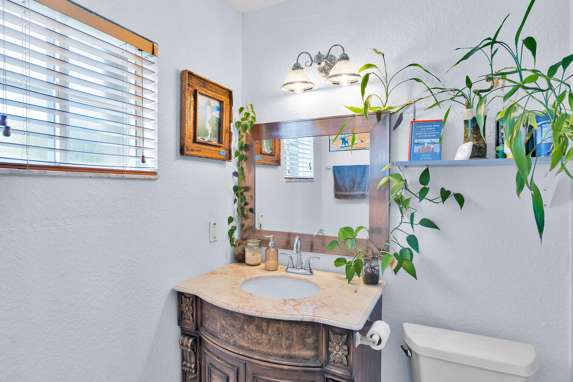 64 Coconut Drive Key Largo, FL 33037 - Photo 33 of 54 a view of a dining room with a table and chairs