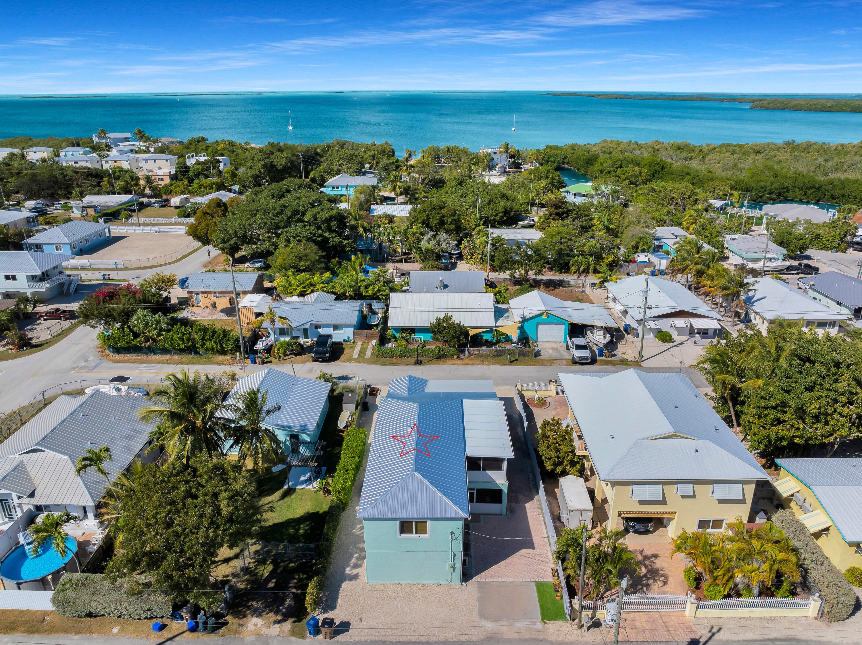 64 Coconut Drive Key Largo, FL 33037 - Photo 45 of 54 an aerial view of residential houses with outdoor space and ocean view